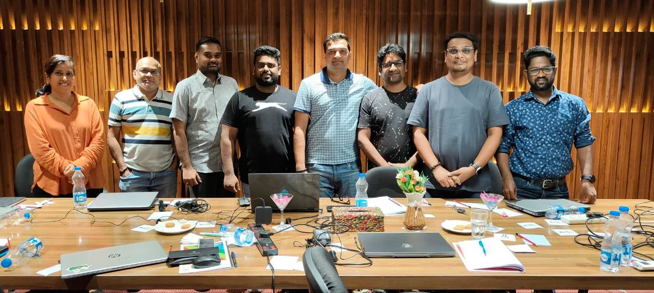 Two mentors with a graduate holding a Certified Tech-Savvy IT Leader certificate